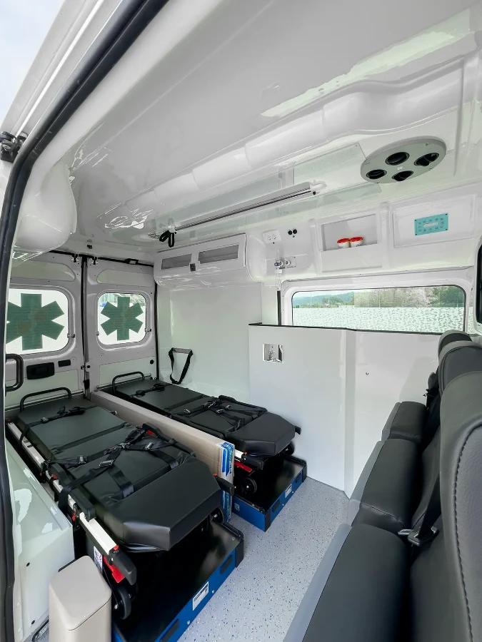 CIB Commerce patient transport ambulance interior with two stretchers and side seating